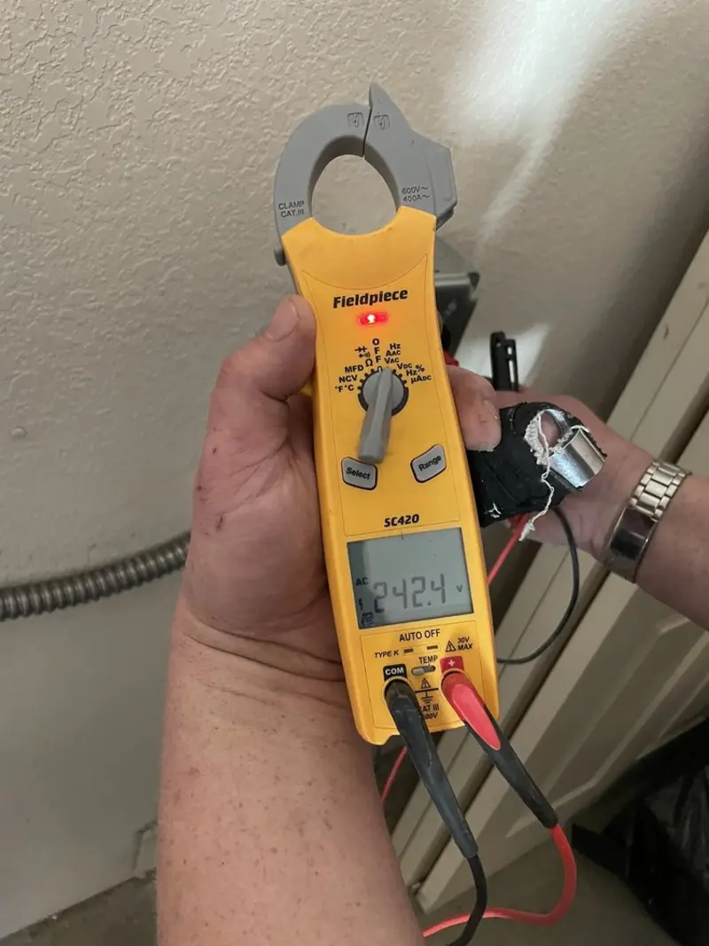 Voltage testing with clamp meter during Recessed Lighting Installation in Canby